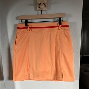 LBH skort Orange with Red Accents. Pocket on side and back.